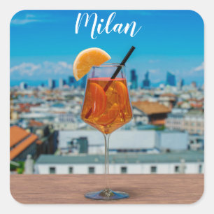 Spritz cocktail on a table with view of Milan Square Sticker