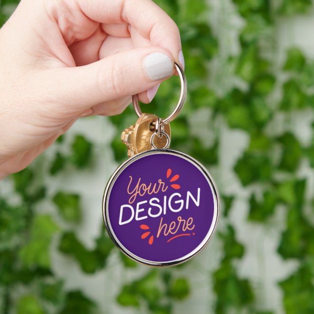 Square purple graphic with playful orange key ring (Hand)