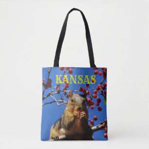 Squirrel eating red berries Grocery Tote Bag