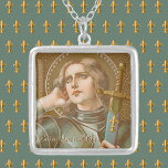 St. Joan of Arc (JM 28) Silver Plated Necklace<br><div class="desc">St. Joan of Arc, the “Maid of Orleans”, is patron saint of women who serve in the military. In this depiction, her military career is emphasised. St. Joan is clad in contemporary 15th-century plate armour and shoulders a sword in a scabbard ornamented with fleur di lis. The fleur di lis,...</div>