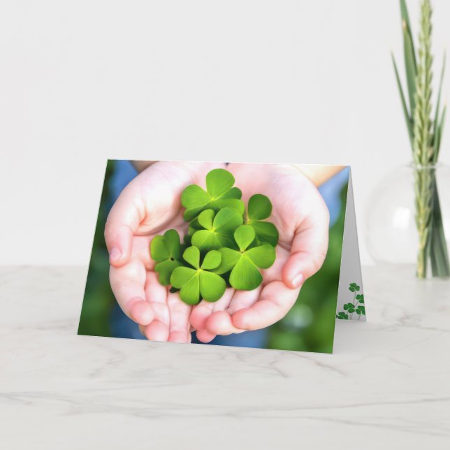 St. Patrick's Day Four-Leaf Clovers In Hand Holiday Card (Front)