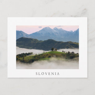 St. Thomas church with mountains in Slovenia white Postcard