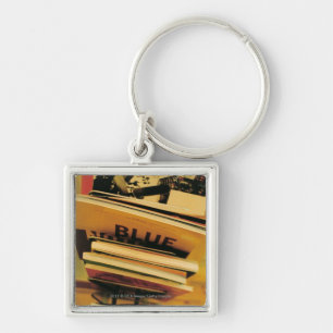 Stack of books and magazines key ring