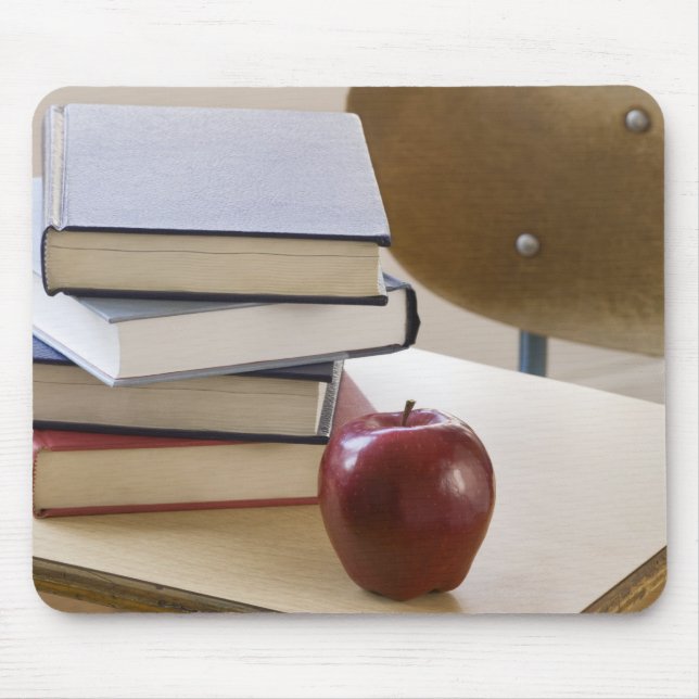 Stack of books, apple, and school desk mouse mat (Front)