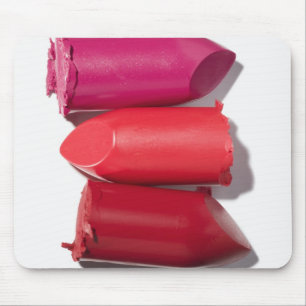 Stack of broken lipstick mouse mat