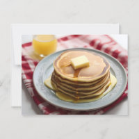 Stack of pancakes on plate covered with syrup