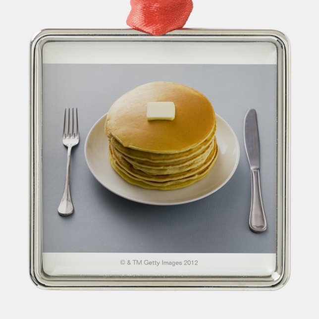 Stack of pancakes with butter on a plate metal tree decoration (Front)