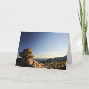 Stack of Wish Rocks balancing on a larger rock Card