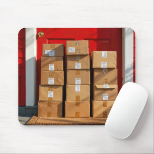 Stacked Cardboard Boxes By a Red Door Mouse Mat