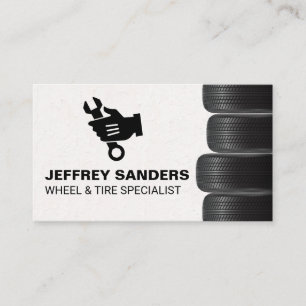 Stacked Tires Mechanic Holding Wrench Logo Business Card