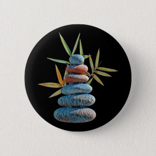 Stacked zen stones in balance with bamboo leaves.  6 cm round badge