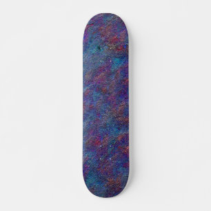 Stained cyan and red paint leftover splatters skateboard