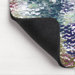 Stains and splatters of paint under hammered glass mouse mat
