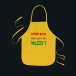 Stand Back This Could Get Messy - child's Kids Apron<br><div class="desc">Stand Back This Could Get Messy - a child's apron for messing around in the kitchen,  or with crafts.  It has bright red,  blue and green bright lettering on a yellow apron.</div>