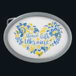 Stand with Ukraine lettering and heart Belt Buckle<br><div class="desc">Stand with Ukraine lettering and heart in Ukrainian flag colours and transparent ethnical pattern Folk art illustration heart and lettering in Ukrainian flag colours and ethnical pattern heart, shape, Purity, Allegory, peace sign, peace symbol, peace, no war, stop war, antiwar, Ukraine, Ukrainian, ethnical pattern, Ukrainian flag, blue and yellow, proud,...</div>