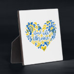 Stand with Ukraine lettering and heart Plaque<br><div class="desc">Folk art illustration heart and lettering in Ukrainian flag colors and ethnical pattern</div>