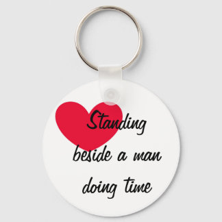 Standing beside a man doing time Keychain