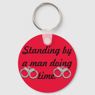 Standing by a man doing time keychain