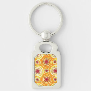 Starbursts and pinwheels, saffron and raisin key ring