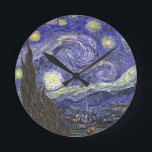 Starry Night by Vincent van Gogh Round Clock<br><div class="desc">Starry Night by Vincent van Gogh is a vintage fine art post impressionism landscape cityscape painting featuring a view of Saint Remy, France from van Gogh's asylum. The night sky is swirling with clouds with a bright crescent moon and shining stars over the quaint village. Starry Night is probably van...</div>