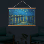 Starry Night Over the Rhône | Vincent van Gogh Hanging Tapestry<br><div class="desc">Starry Night Over the Rhône (1888) by Vincent van Gogh is a mesmerising Post-Impressionist painting that captures a serene nighttime view of the Rhône River in Arles, France. The artwork features a deep blue sky adorned with shimmering golden stars and their reflections on the water. In the foreground, two figures...</div>
