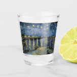 Starry Night  Vincent  van Gogh    Shot Glass<br><div class="desc">Thatched Cottages at Cordeville. Vincent Willem van Gogh.Night landscape in dark blue and yellow tones. There is a bridge across the river. In the foreground, a man and a woman are walking along the embankment. The stars are shining in the sky. Reproduction of famous works of art images in the...</div>