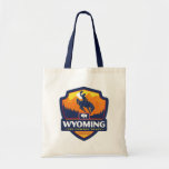 State Pride | Wyoming Tote Bag<br><div class="desc">Anderson Design Group is an award-winning illustration and design firm in Nashville,  Tennessee. Founder Joel Anderson directs a team of talented artists to create original poster art that looks like classic vintage advertising prints from the 1920s to the 1960s.</div>