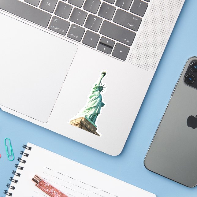 statue of liberty (Laptop w/ iPhone)