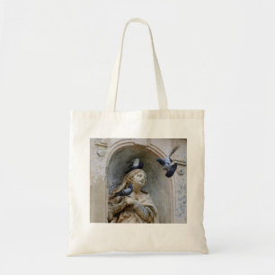 Statue with pigeons tote bag