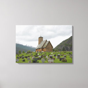 Stave church with graveyard in Norway canvas