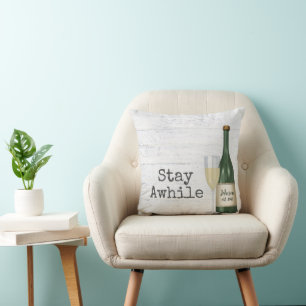 Stay Awhile Wine Bottle On Wood Cushion