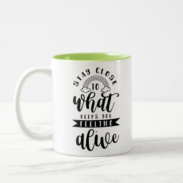 Stay close to what keeps you feeling alive Two-Tone coffee mug (Left)