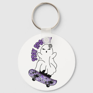 "Stay Spooky" Ghost on a Skateboard – Cool Purple Key Ring