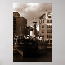 Steel Vessel In Front Of Houses