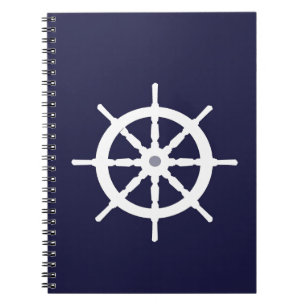Steering wheel on navy blue background. notebook