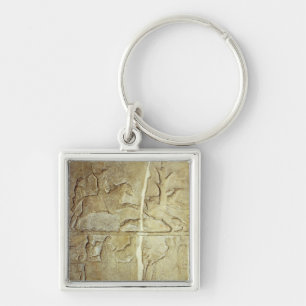 Stela relief depicting a wild boar hunt key ring