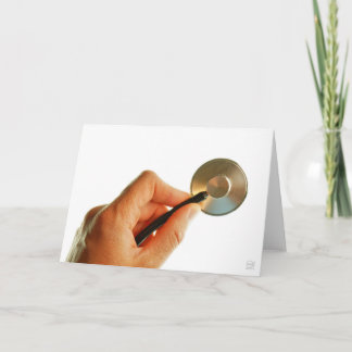 Stethoscoop in een hand voor een ziekenhuis sfeer. thank you card
