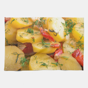 Stew of potatoes with onion, bell pepper and dill tea towel