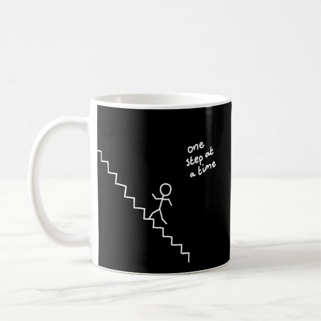 Stick man on the stairs "one step at a time" mug (Left)