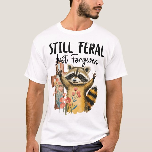 Still Feral Just Forgiven Cross Racoon Christian T-Shirt (Front)