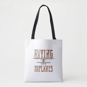 still fly playing with aeroplanes tote bag
