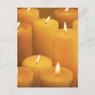 Still life of lighted candles postcard