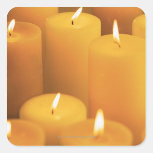 Still life of lighted candles square sticker