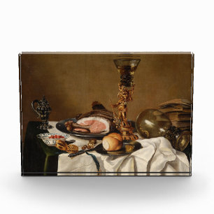 Still life with ham, books and ornamental vessels photo block