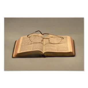 Still life with open bible and reading glasses photo print