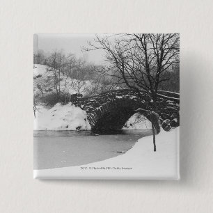 Stone bridge over snow covered river 15 cm square badge