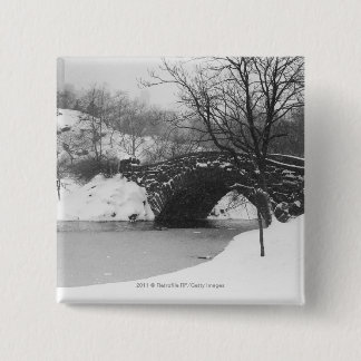 Stone bridge over snow covered river 15 cm square badge
