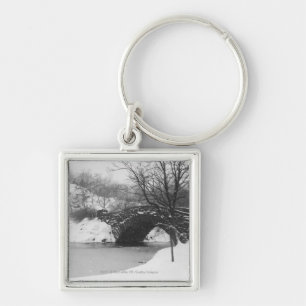Stone bridge over snow covered river key ring