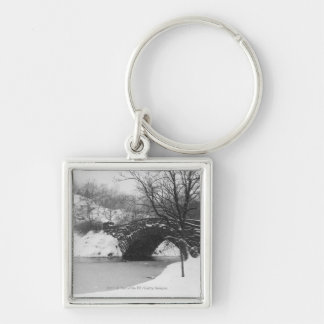 Stone bridge over snow covered river key ring