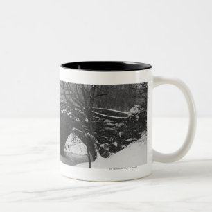 Stone bridge over snow covered river Two-Tone coffee mug